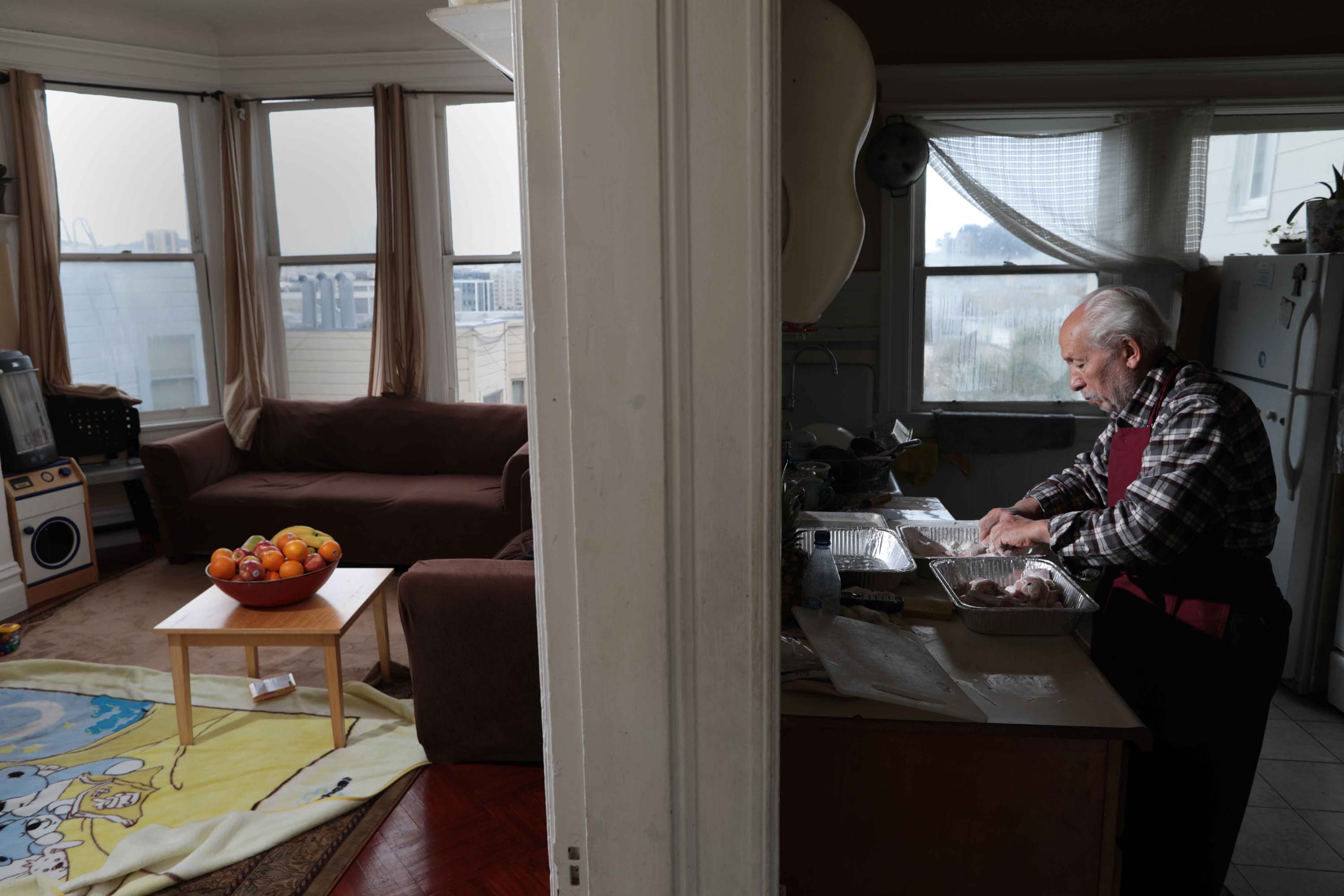 Emam Saber, 77, works in his kitchen in San Francisco. The retired chef has regularly volunteered to cook for nonprofits and mosques for decades.